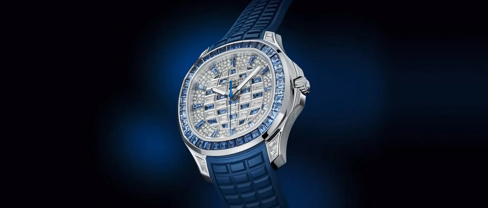 Patek Philippe Aquanaut Luce Haute Joaillerie 5268/461G-001 in white gold, its bezel set with blue sapphires and its dial with diamonds and blue sapphires, on a blue strap