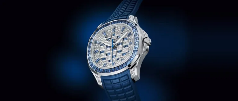 Patek Philippe Aquanaut Luce Haute Joaillerie 5268/461G-001 in white gold, its bezel set with blue sapphires and its dial with diamonds and blue sapphires, on a blue strap